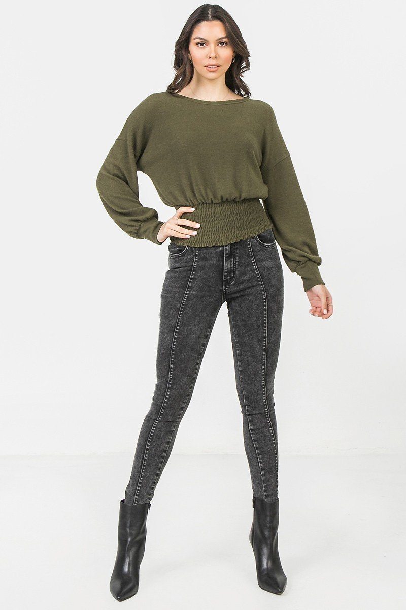 A Knit Top Featuring Wide Neckline