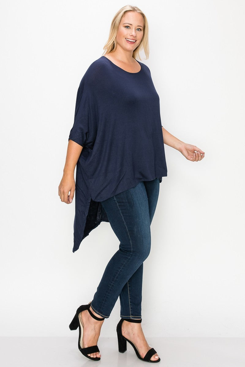 Solid top featuring a round neck, three quarter sleeves, and a high-low hem