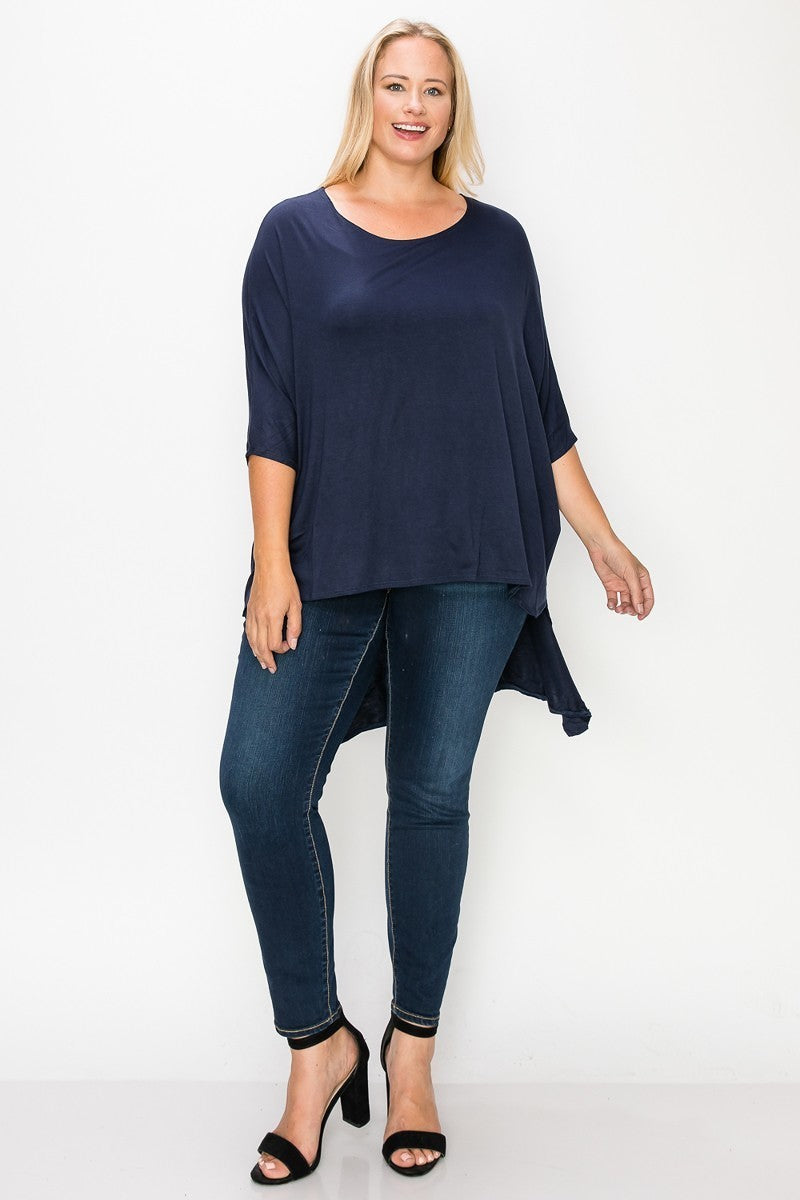 Solid top featuring a round neck, three quarter sleeves, and a high-low hem