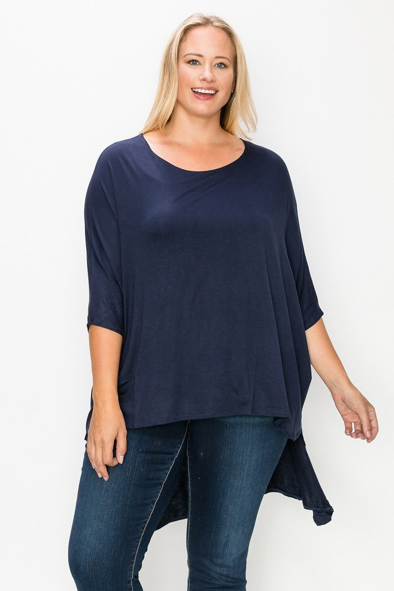 Solid top featuring a round neck, three quarter sleeves, and a high-low hem